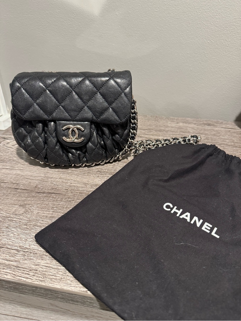 CHANEL Black Quilted Mini Crossbody with Silver Chain